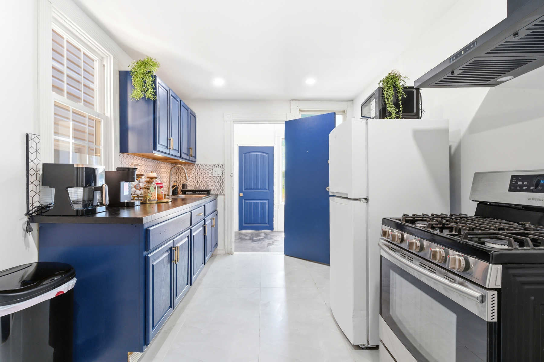 Blue and white full kitchen