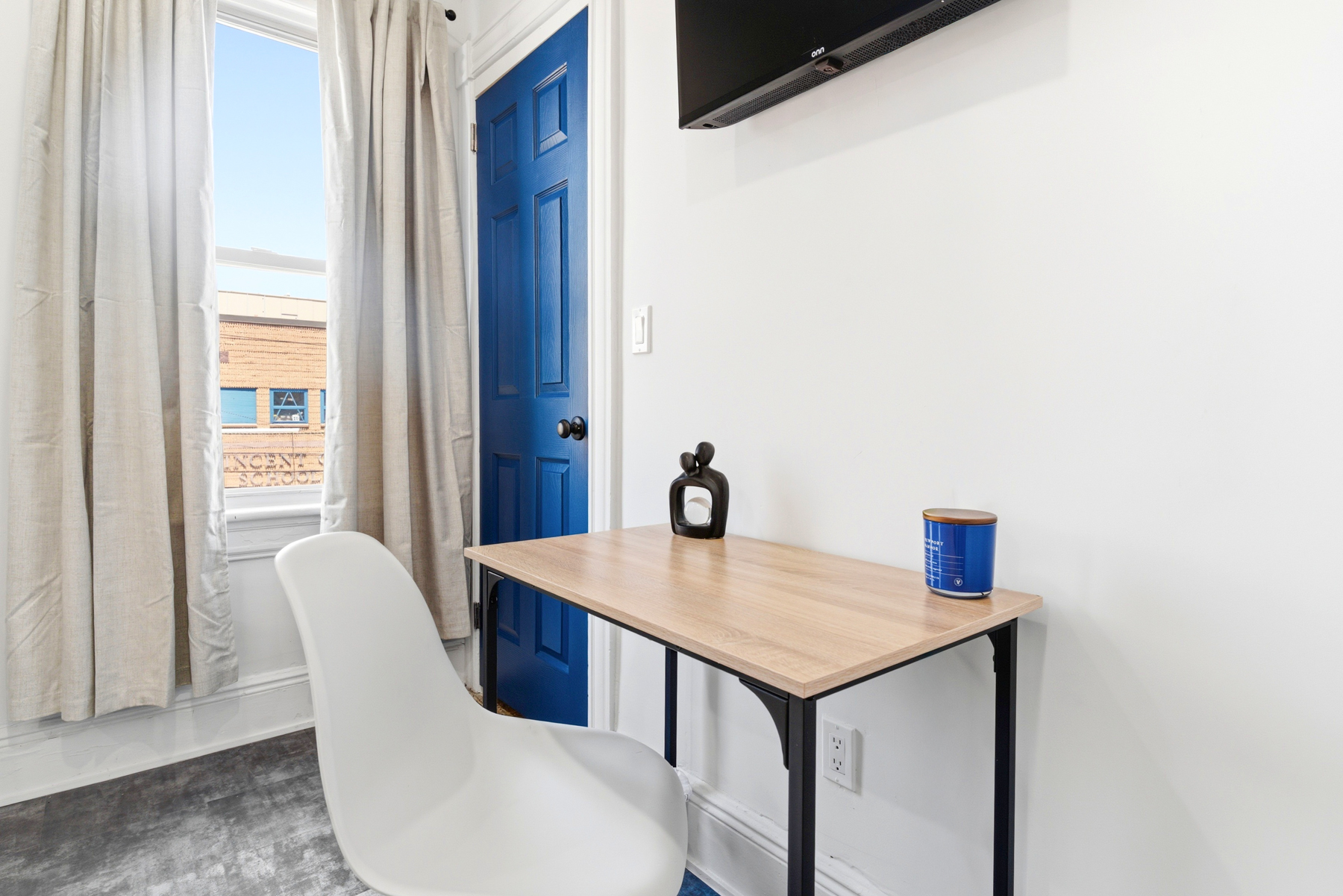 Private bedroom workspace and television